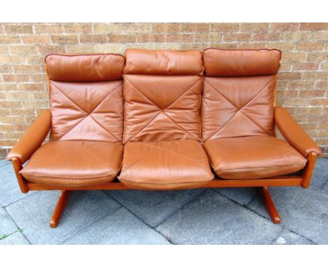 LIED MOBLER, NORWAY:  a 1980s three seater leather upholstered sofa on teak frame, 194cm wide 81cm deep 94cm high