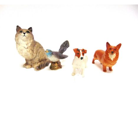 A GROUP OF FOUR BESWICK ANIMALS:  a seated cat model 1867, 20cm high (ear re-glued), a cuckoo model 2315, a Jack Russell terr