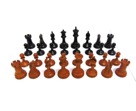 A STAUNTON PATTERN BOXWOOD & EBONY WEIGHTED CHESS SET  unsigned, the kings 79mm high (the white lacking crown finial), contai