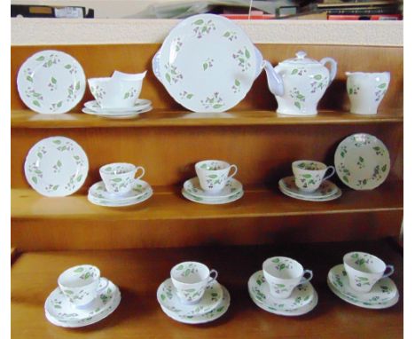 A SHELLEY 'CAMPANULA' TEA SERVICE  comprising teapot, milk jug, sugar bowl, seven cups, eight saucers, eleven side plates and