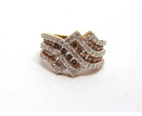 A 9 CARAT GOLD DIAMOND AND COGNAC DIAMOND DRESS RING set with crossing lines of fifty seven brilliant cuts, totalling approxi