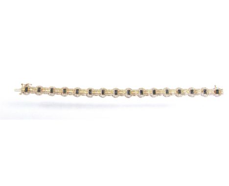 A 9 CARAT GOLD DIAMOND AND BLUE DIAMOND BRACELET  the alternating circle of single cut diamonds with a central panel of six b