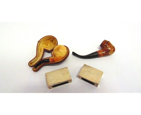 A MEERSCHAUM 'NOSE WARMER' PIPE in original fitted case marked for Phillip Morris & Co Ltd; another pipe carved as a gentlema