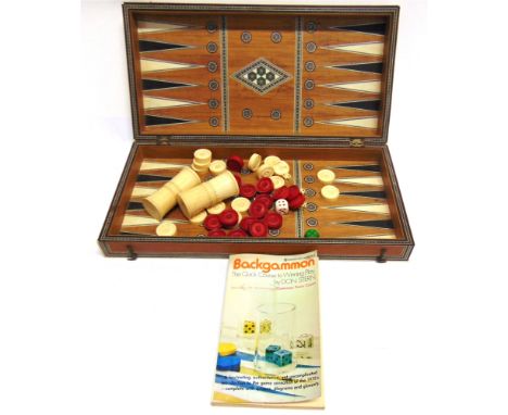 AN INDIAN IVORY-INLAID FOLDING BACKGAMMON / CHESS BOARD  late 19th century, together with a set of thirty-two ivory draughts,