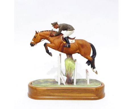 Royal Worcester bone china model of 'Merano and Cap. Raimondo d'Inzeo', by Doris Lindner, on wooden plinth, 29cm high 