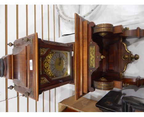 Late 19th century bracket clock, the brass dial with silvered chapter ring with Roman numerals, striking movement, in walnut 