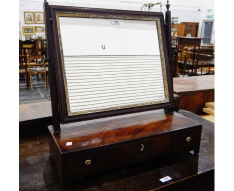 Georgian mahogany swing frame dressing table mirror with oval glass plate, on a box base enclosing three drawers with bracket