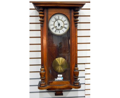 German walnut and glazed wall clock with enamel dial, brass beaded mounts, having eight-day gong striking movement, glazed do