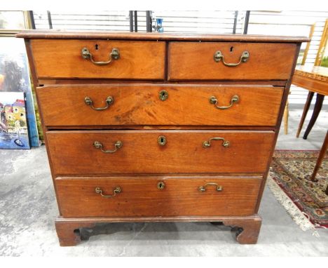 Early 19th century mahogany straight-front chest of two short and three long graduated drawers, each with brass bail handles 