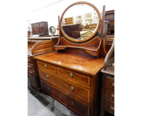 Edwardian mahogany and satinwood inlaid dressing chest, the back with swing frame oval mirror and shelf with trinket drawers,