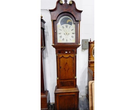 Early 19th century oak longcase clock, the hood with swan-neck pediment, eight-day striking movement, the enamel dial with mo