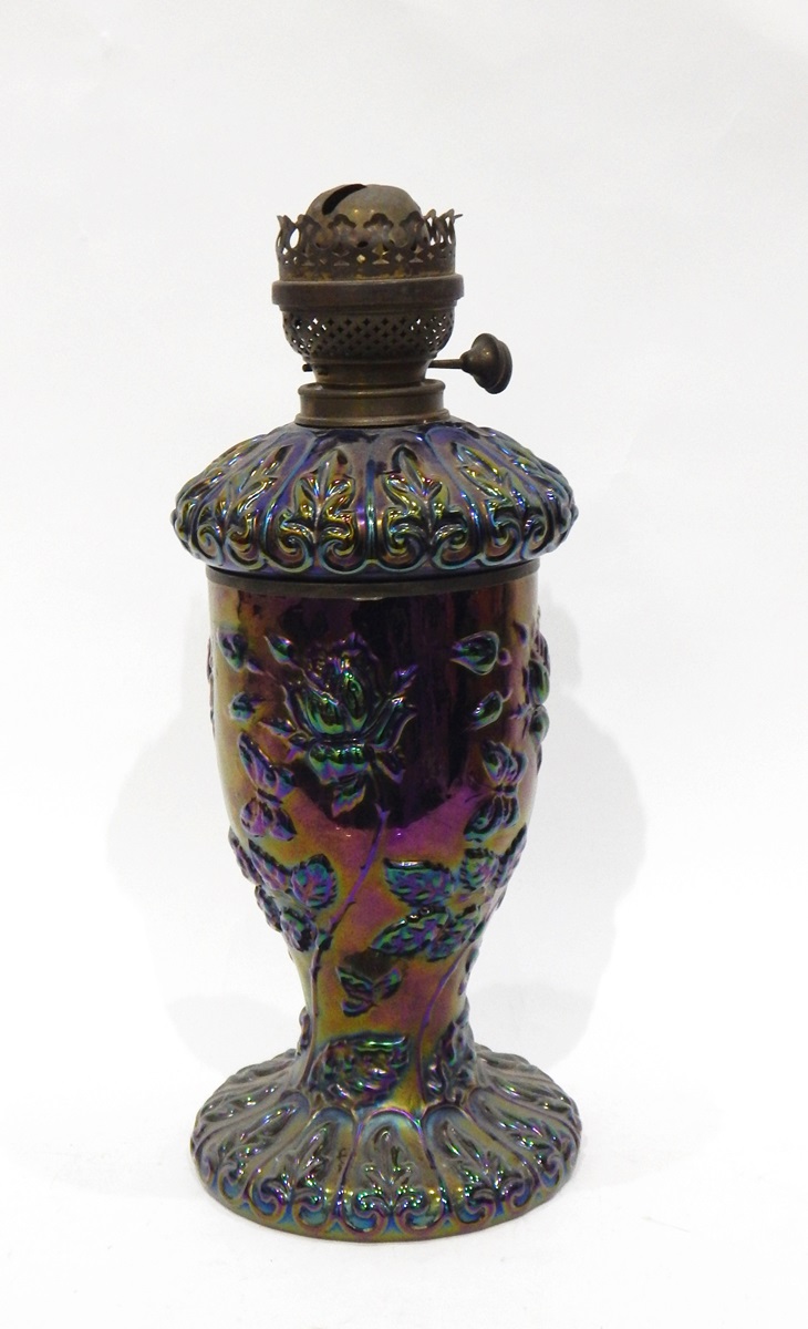 Purple carnival glass oil lamp, the body decorated with roses and