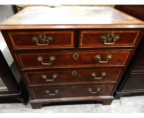 19th century mahogany and satinwood banded chest of two short and three long drawers, on bracket feet, the drawers with brass