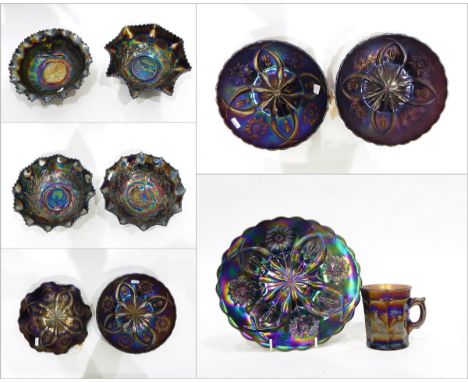 Five assorted carnival glass bowls and dishes in the 'Four Flowers Variant' pattern, four carnival glass bowls with Australia