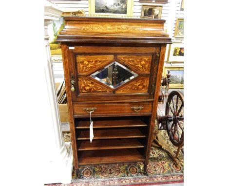 Edwardian inlaid rosewood caddy-top music cabinet having a pierced brass three-quarter gallery, the cupboard door with bevell