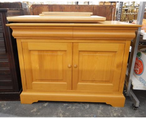 Modern pale chestnut side cupboard by Simon Knowles, with a pair of cushion frieze drawers, fielded panel cupboard below encl