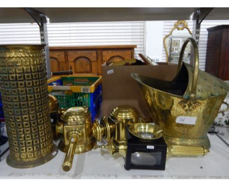 Quantity of brassware including a large coal scuttle, brass carriage lamps, a brass umbrella stand, a brass miner's lamp 