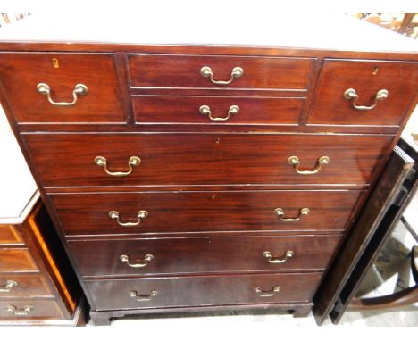 Early 20th century mahogany chest of drawers having an arrangement of four small drawers over four long graduated drawers, wi