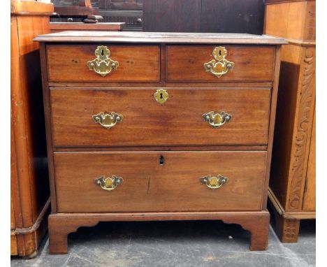 Georgian mahogany chest of drawers with moulded edge top, two short and two long graduated drawers, raised on bracket feet, p