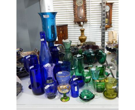 Quantity of green and blue coloured glass to include a large blue glass storm lantern, a set of four wine glasses with green 