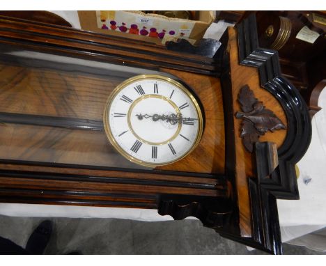 Wall clock, the enamel dial with Roman numerals with subsidiary seconds dial, in walnut case with ebonised arched pediment