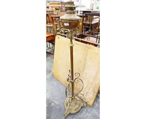 Late 19th century brass oil lamp on a telescopic stand, with circular base (converted to electricity) 