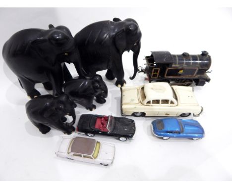 Quantity of playworn Corgi diecast model cars and other items including a very worn Hornby engine and four carved ebonised el