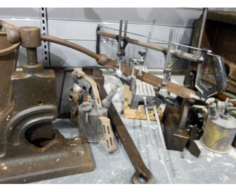 Wooden clamp, gas lamp, measuring chain in metal bucket and a metal shelf, various paraffin lamps, etc. 