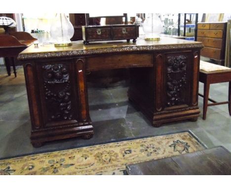 19th century continental carved oak kneehole desk, fitted a drawer to concave kneehole, the pedestals enclosed by high relief