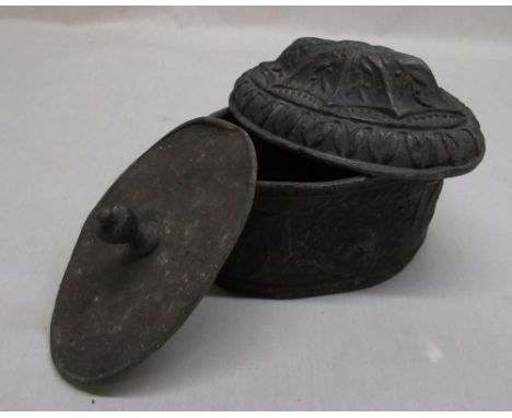 C19th lead tea caddy embossed scrolling leaf design to lid, body decorated with bishop, ships and a fleece sheep heraldic emb