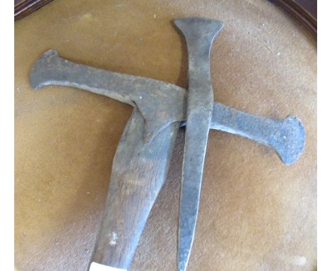 Vintage pickaxe with double bit blade together with another pick axe head 