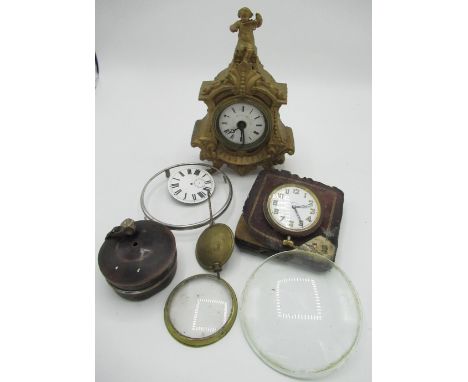 Early C20th French mantel clock alarm in gilt Spelter case, mounted by cherub, early C20th Swiss travelling clock in leather 