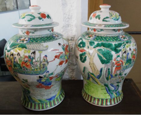 ORIENTAL VASES, a pair, Chinese ceramic of inverted baluster form with lids, decorated figures in a landscape in the Famille 