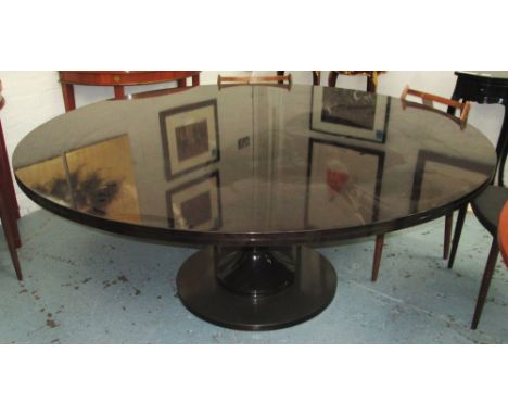 'IRON LADY' DINING TABLE, dark oak, round top on ball column base, 180cm diam x 75cm H (with faults).