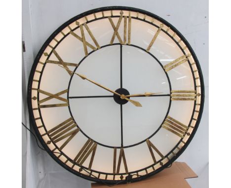 WALL CLOCK, electric, with Roman numerals in front of a glass light box, 120cm diam.