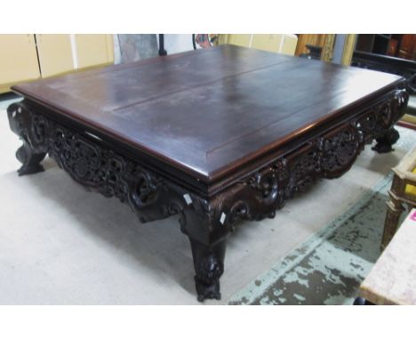 BED, late19th/early 20th century Chinese hardwood with a rectangular top and a scroll carved apron on cabriole legs with tort