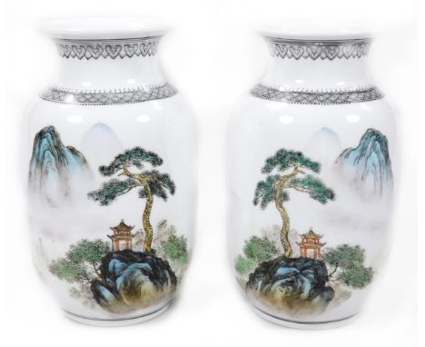 A pair of Chinese Republic style porcelain vases, each with compressed trumpet stems, on shouldered bodies, polychrome decora