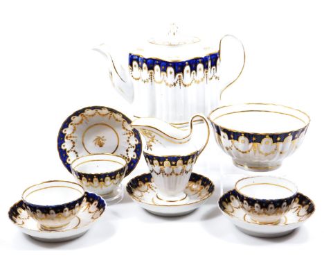 A late 18thC New Hall porcelain fluted part tea service, c.1790, pattern no. 153, in a blue ground, with gilt stars and dots 