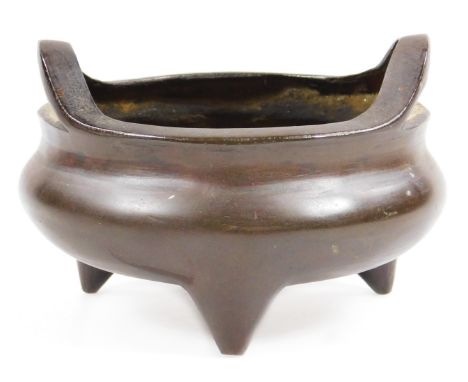 A Chinese cast bronze censer, bearing seal mark to the base, probably late Qing period, 11cm dia., 8cm H.