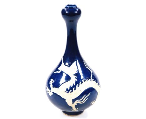 A Chinese porcelain vase, Wanli six character mark beneath, of garlic shape, with inverted stem and bulbous body, richly glaz