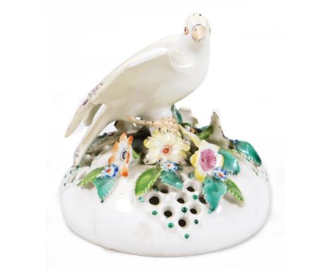 An 18thC Derby porcelain pot pouri vase cover, c.1765, the pierced cover surmounted with a large canary, signs of patch marks