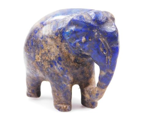 An oriental soapstone model of a elephant, c1900, 7cm long.Auctioneer Announce no coffee cup in this lot.