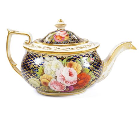 An early 19thC Spode teapot and cover, decorated with large flower sprays on a blue scale ground, unmarked, 28cm long, minor 