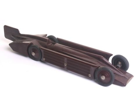 A Ranlite Bakelite c/w model of H.Segrave’s Land Speed Record Golden Arrow, circa 1931, dark maroon with black Dunlop Cord ru