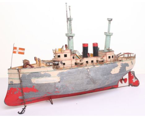 Carette tinplate c/w Battleship, circa 1910, red and cream painted hull, light brown decks, superstructure withy forward and 