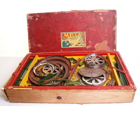 Collection of playworn 1950s Meccano, large selection of mainly red and green component, wheels, cogs, strips and more includ
