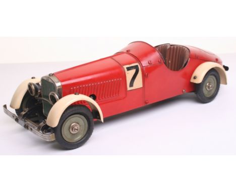 Marklin 1107R c/w constructors racing car, circa 1935, finished in red and cream with green wheels, exhaust pipes and radiato