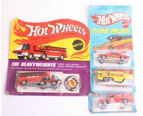 Scarce Hot Wheels Redline The Heavyweights Fire Engine, model is mint, with original badge, still in header card, which shows