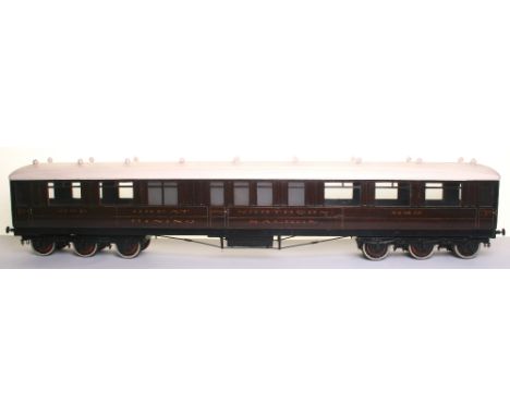 * Two 3 ¼” gauge wooden model Great Northern coaches, late 19th early 20th century, with cast iron twelve wheel double sprung