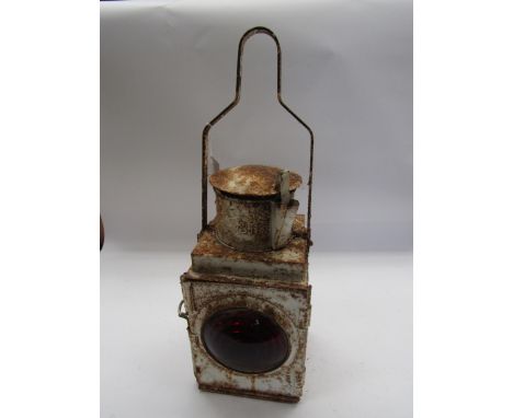 A white painted BR tail lamp with reservoir and burner, stamped to the top
